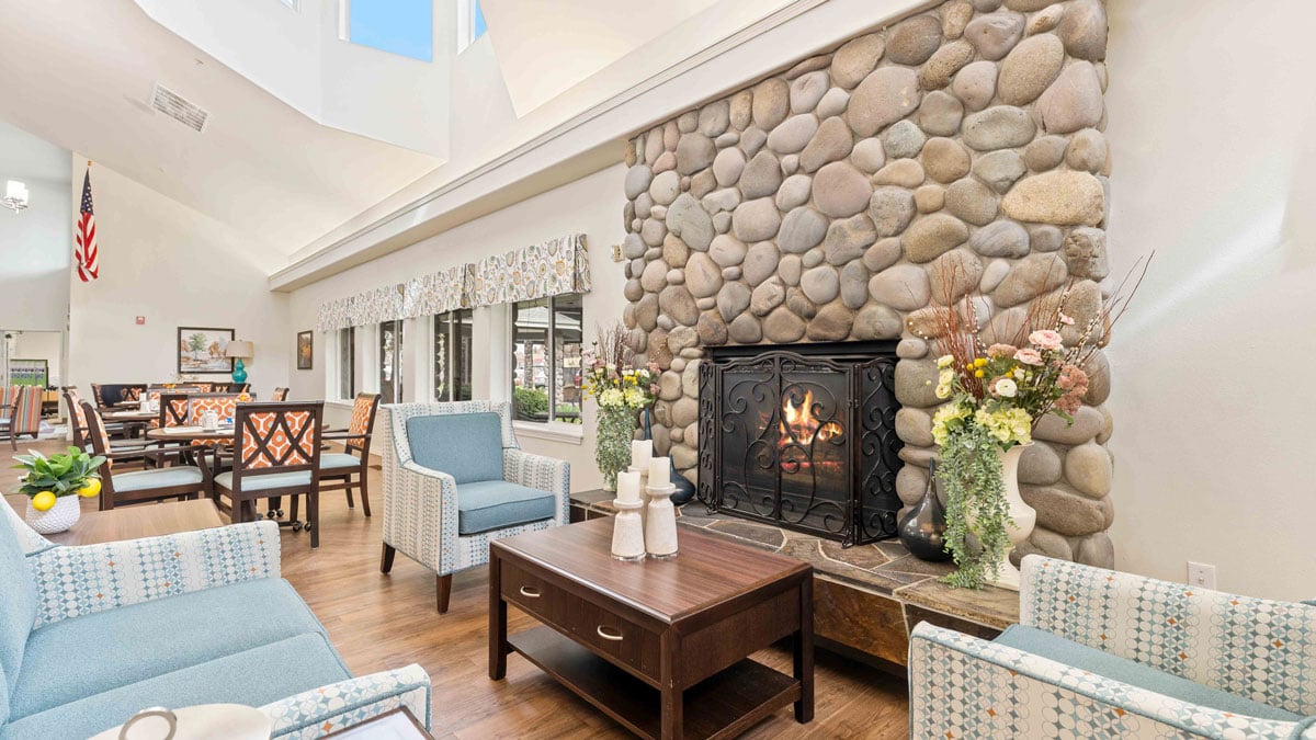 A cozy fireplace lounge at Stone Lodge