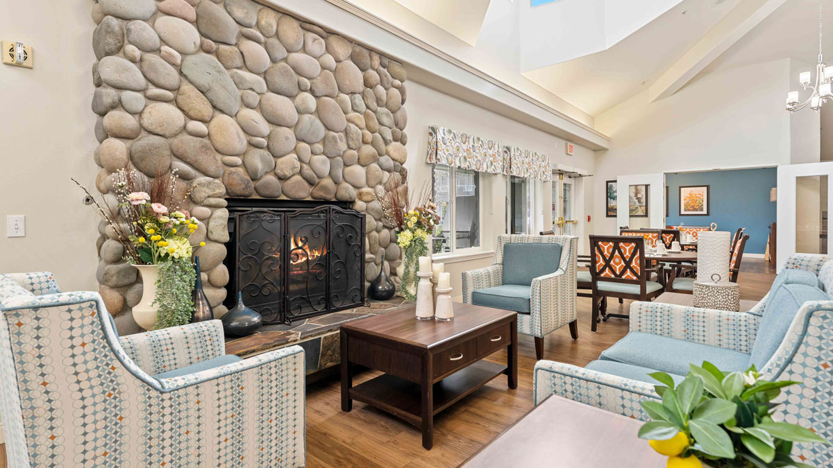 A cozy fireplace lounge at Stone Lodge